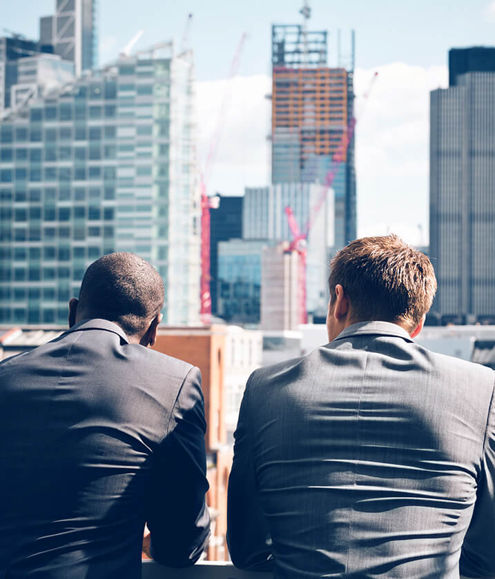 business-men-city-buildings the equiton difference in real estate investing