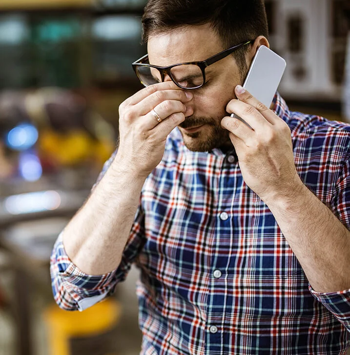 man-stressed-phone-multi-residential multi-residential